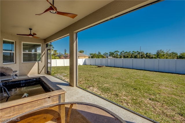 view of yard with a patio area and ceiling fan