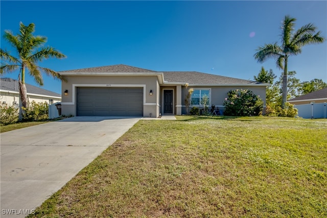 single story home featuring a front lawn and a garage