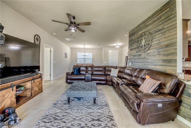 tiled living room with ceiling fan