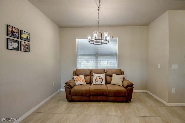 living room with a notable chandelier and light tile patterned flooring