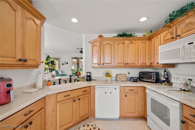 kitchen featuring ceiling fan, sink, light tile patterned flooring, and white appliances