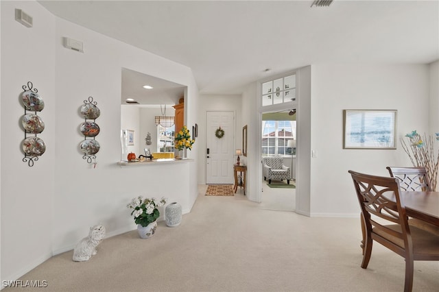 view of carpeted entrance foyer