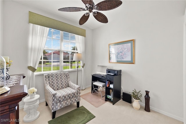 carpeted office space with ceiling fan