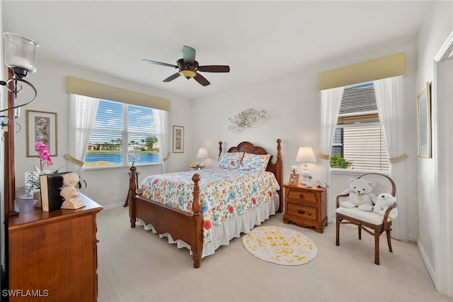 carpeted bedroom with ceiling fan