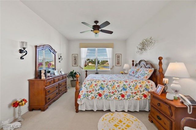 bedroom with ceiling fan and light carpet