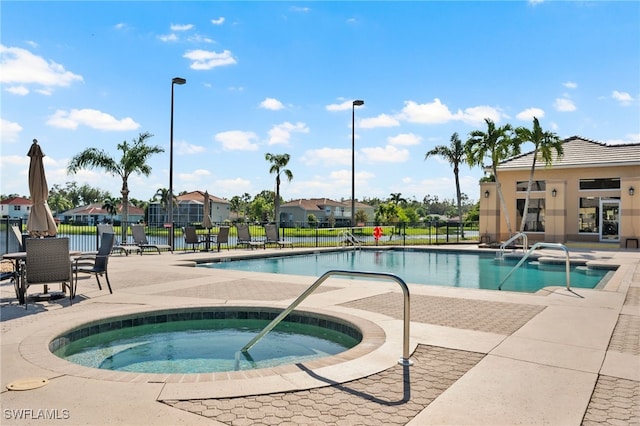 view of pool with a community hot tub