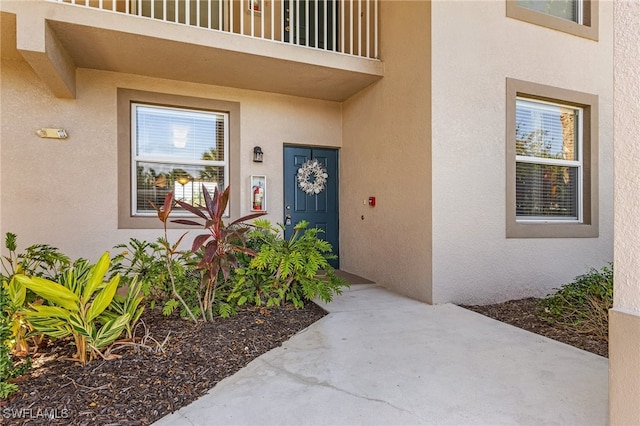 entrance to property with a balcony