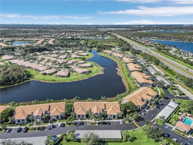 birds eye view of property featuring a water view