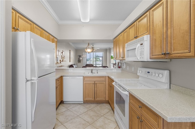 kitchen featuring white appliances, sink, crown molding, light tile patterned floors, and kitchen peninsula