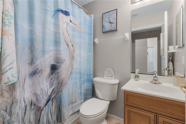 bathroom with vanity, toilet, and walk in shower