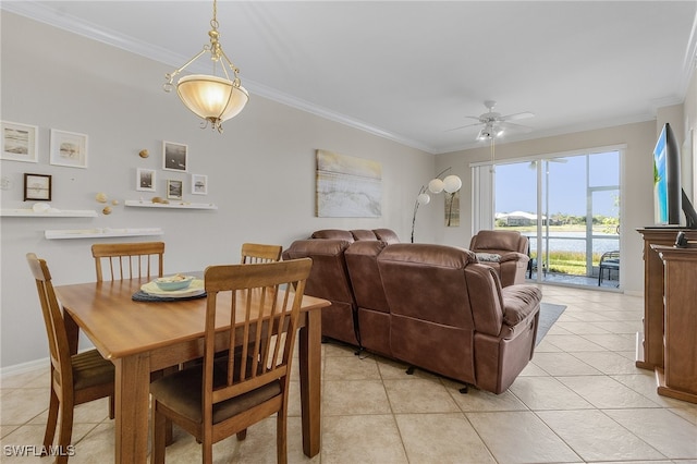 dining area featuring crown molding, ceiling fan, and light tile patterned flooring