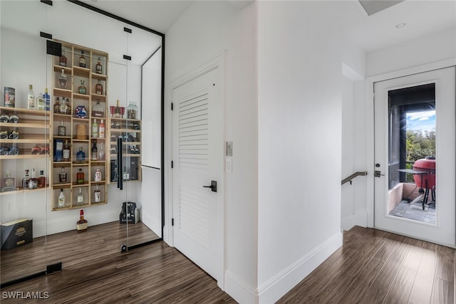 hallway featuring dark hardwood / wood-style flooring