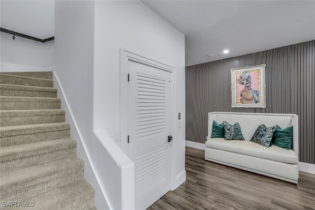 staircase featuring hardwood / wood-style flooring