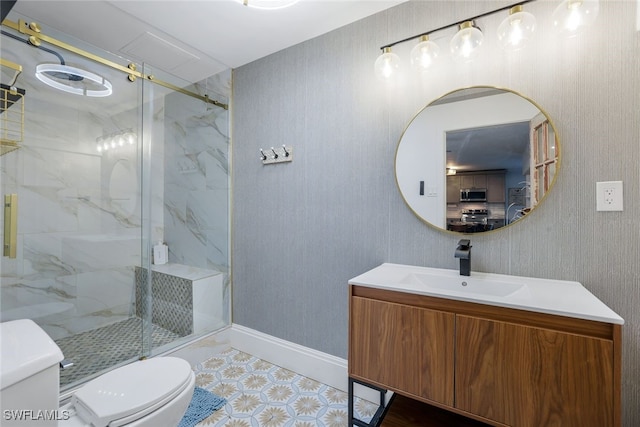 bathroom featuring vanity, an enclosed shower, and toilet