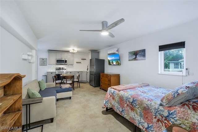 bedroom featuring stainless steel refrigerator and ceiling fan