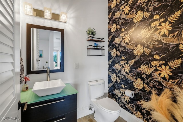 bathroom with vanity and toilet