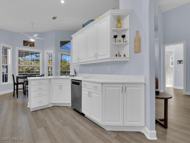 kitchen featuring white cabinets, dishwasher, and light hardwood / wood-style floors