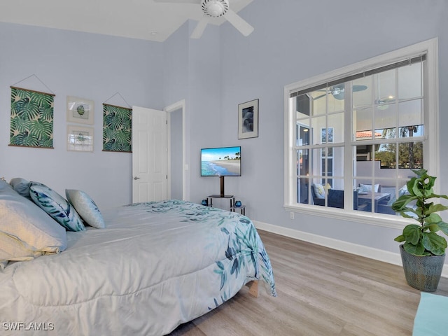 bedroom featuring ceiling fan and hardwood / wood-style floors