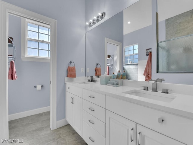 bathroom with vanity and an enclosed shower