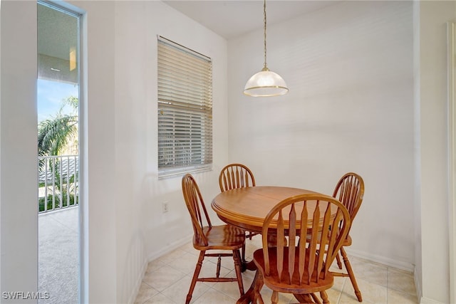 dining space featuring light tile patterned flooring