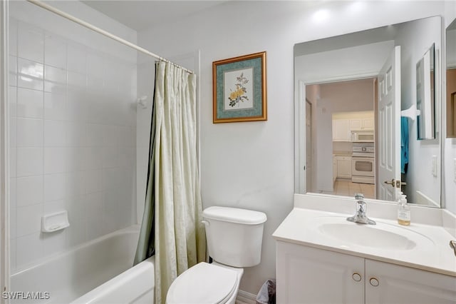 full bathroom with vanity, shower / bath combo, and toilet