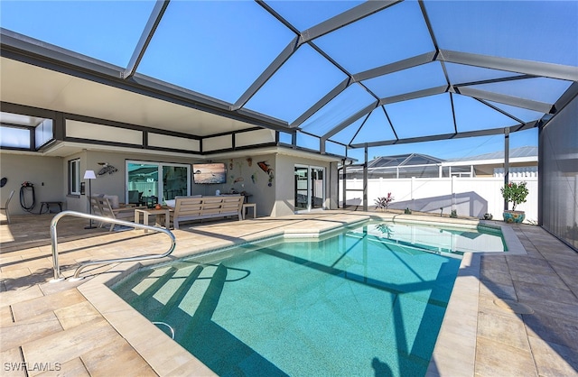 view of swimming pool with a patio area, glass enclosure, and an outdoor living space