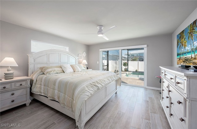 bedroom featuring access to outside, ceiling fan, and light hardwood / wood-style flooring