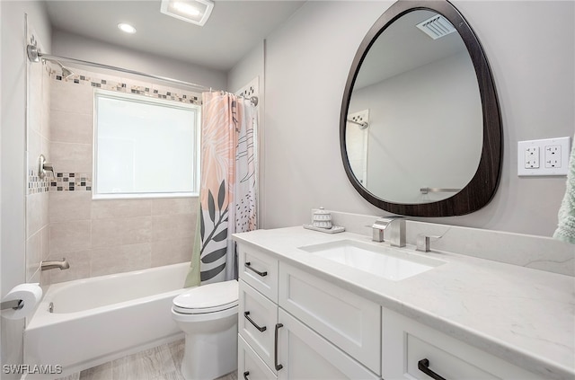 full bathroom featuring toilet, vanity, and shower / bath combination with curtain