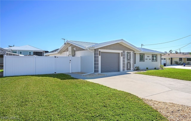 ranch-style house featuring a front yard and a garage