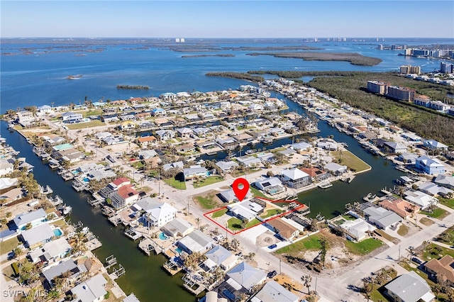 birds eye view of property featuring a water view