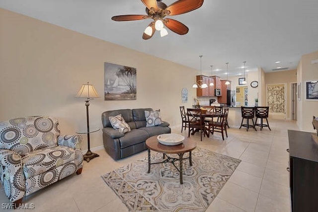 tiled living room featuring ceiling fan