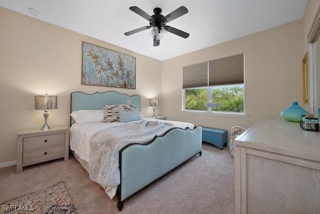 bedroom with light carpet and ceiling fan