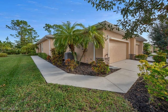 view of property exterior with a yard and a garage