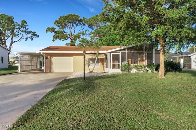 view of front facade with a garage, a sunroom, a carport, and a front lawn