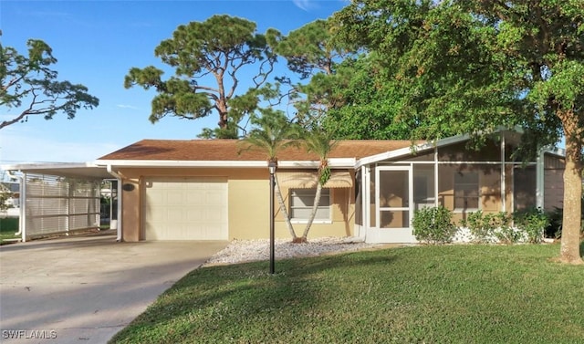 view of front of home featuring a garage, a front yard, a sunroom, and a carport