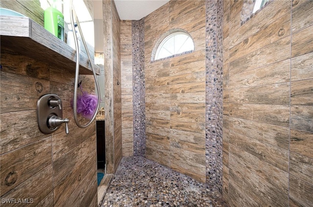 bathroom with a tile shower