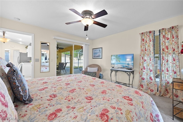 bedroom with stainless steel fridge, ceiling fan, access to exterior, carpet flooring, and vaulted ceiling