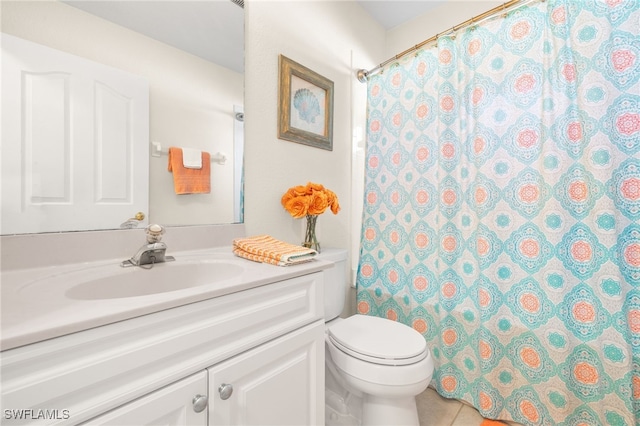 bathroom featuring tile patterned flooring, vanity, a shower with shower curtain, and toilet