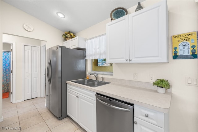 kitchen with white cabinetry, appliances with stainless steel finishes, and sink