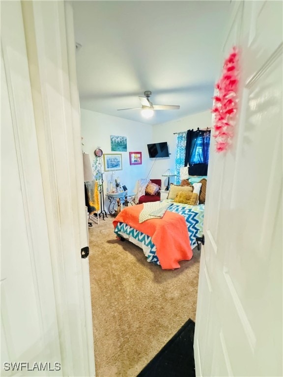 carpeted bedroom featuring ceiling fan