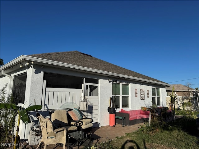 rear view of house featuring outdoor lounge area