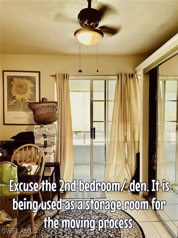 interior space with ceiling fan, french doors, and tile patterned flooring