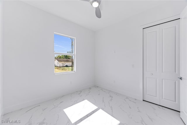 unfurnished bedroom featuring a closet and ceiling fan