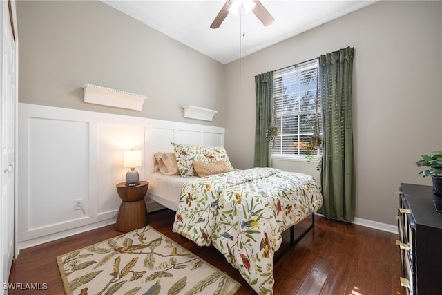 bedroom with ceiling fan and dark hardwood / wood-style floors