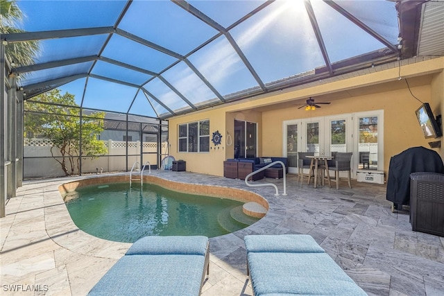 view of pool featuring french doors, area for grilling, a lanai, ceiling fan, and a patio area