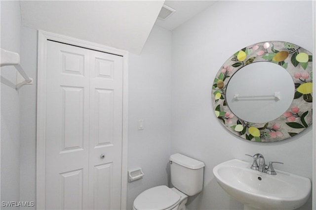 bathroom featuring sink and toilet