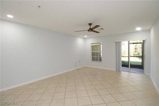 unfurnished room with ceiling fan and light tile patterned flooring