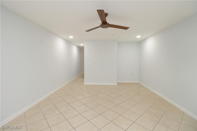 unfurnished room with light tile patterned floors and ceiling fan