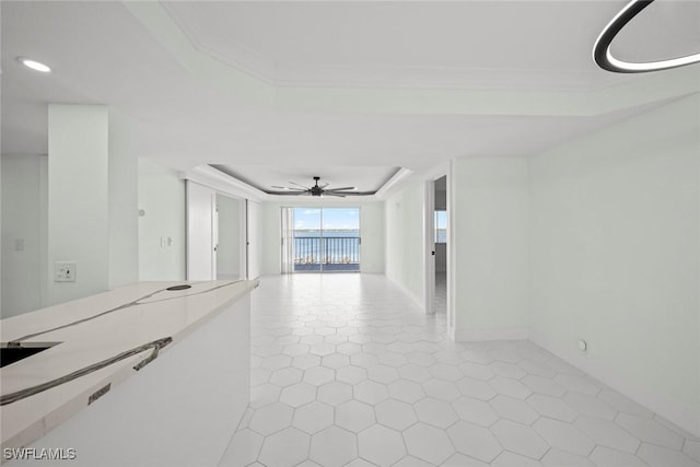 spare room featuring ceiling fan and light tile patterned flooring