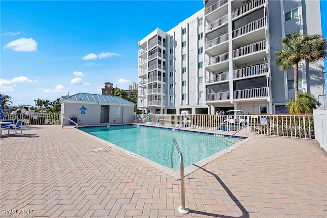 view of swimming pool featuring a patio area